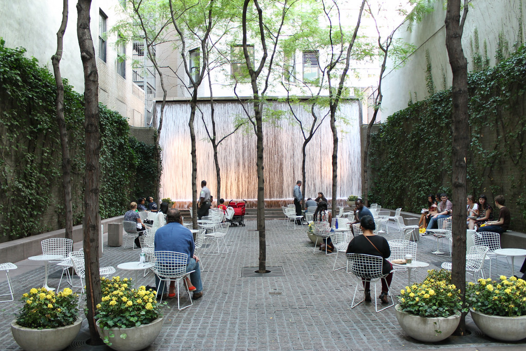 Ivy-covered walls enclosing an outdoor cafe